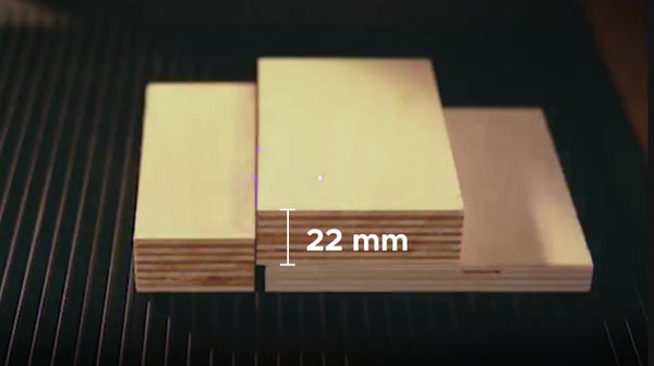 Wood cutting samples with a 22 mm thickness label on the center piece.