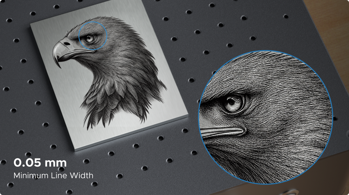 Eagle engraving on a metal plate with a magnified view of the eye and feathers and a 0.05 mm line-width callout.