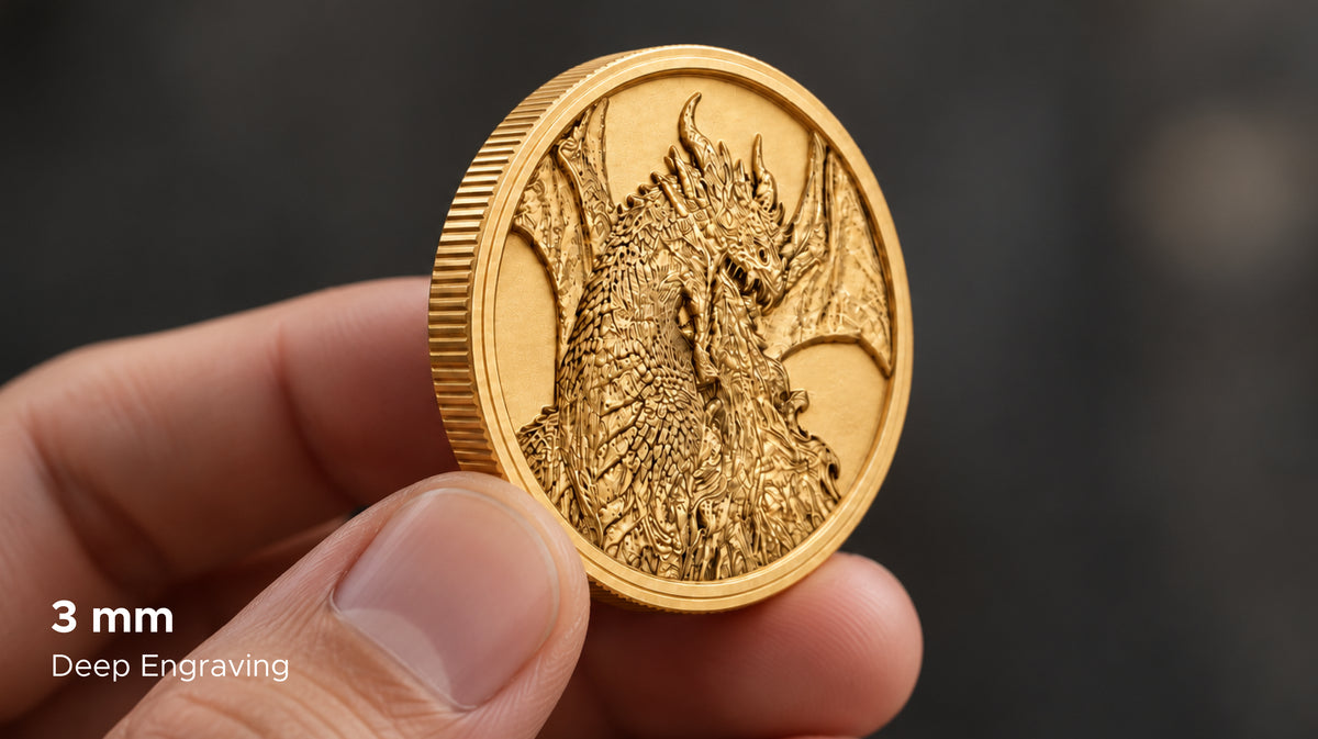 Gold-colored coin held between fingers, showing an engraved dragon and a 3 mm deep-engraving callout.